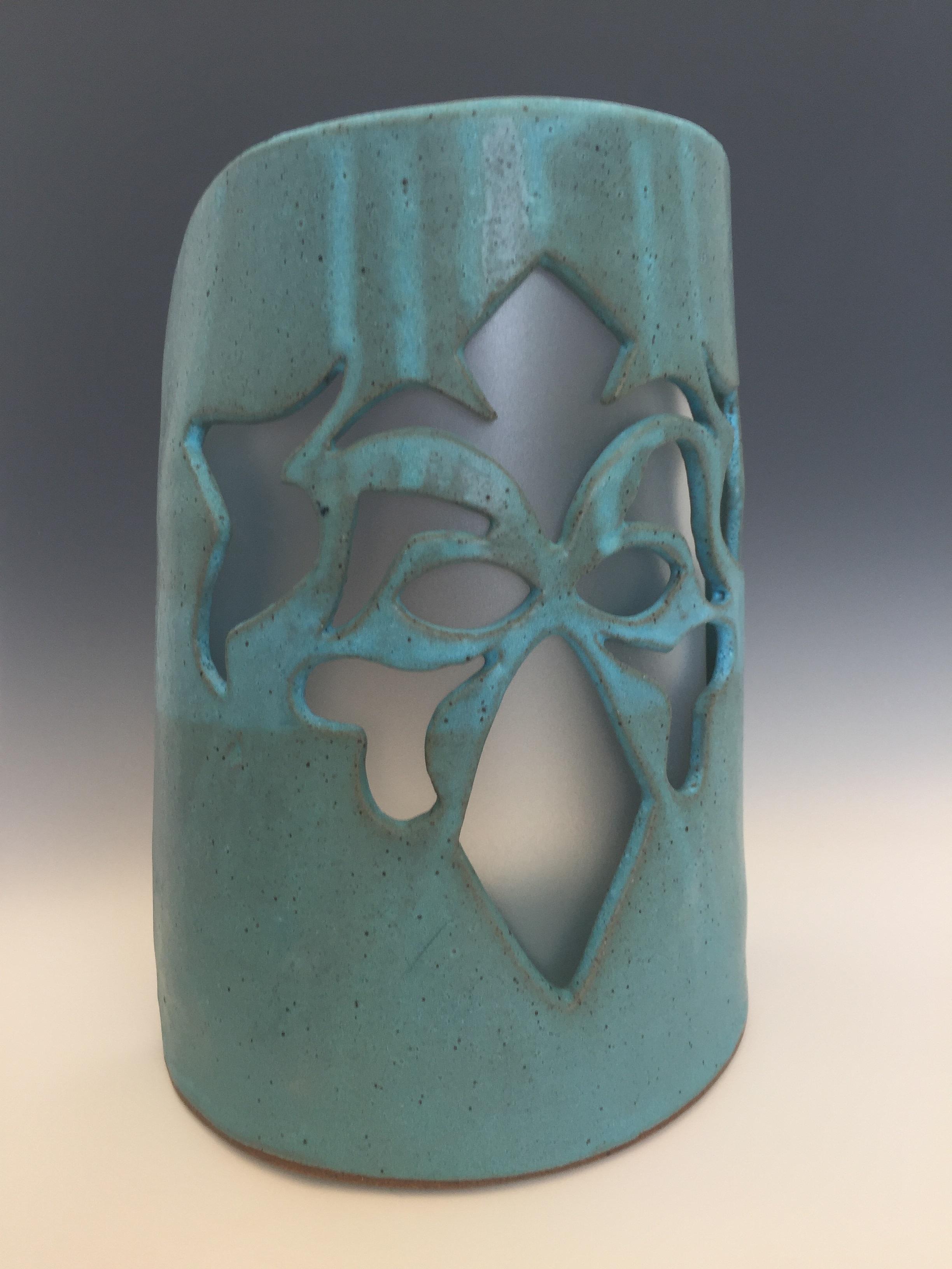 Sconce mystical face with plastic insert