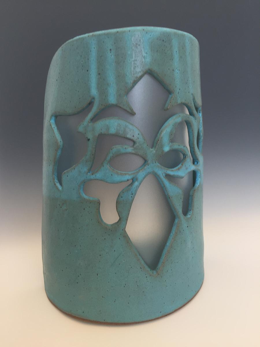 Sconce mystical face with plastic insert
